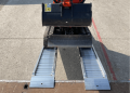 Plant ramps resting on flat bed vehicle 