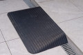 Rubber threshold ramp infront of a step