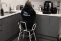 lifestyle image of person on chair in kitchen