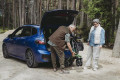 Lightweight rollator being lifted into car boot