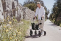 Rollator in use as a walking aid