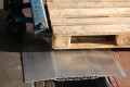 Pallet truck on loading bridge