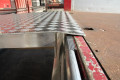 Loading bridge resting on vehicle