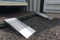 Pair of container ramps resting on container