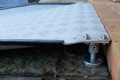 Threshold ramp sat flush with step 
