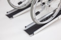 End of telescopic channel ramps with a manual wheelchair going up the access ramp 