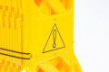 Yellow expandable barrier with warning symbols