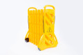 Yellow plastic expandable barrier on wheels