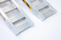 Pair of loading ramps resting securely on the ground 