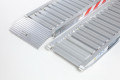 Pair of aluminium loading ramps rest on connection and ramp foot