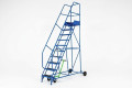Tall mobile industrial ladder on wheels