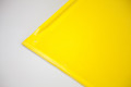 Anti-slip surface on yellow kerb ramp 