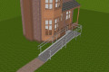 modular ramp with handrails infront of a home