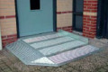 Mini threshold ramp for doorways