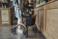 Rollator with bag and backrest