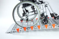 Manual wheelchair going up the RollAble wheelchair ramp
