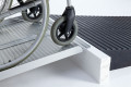 Side view of wheelchair ramp with step