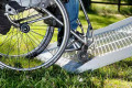 Wheelchair going up mesh ramp 