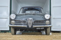 Vintage car coming out of container