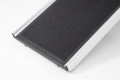 Black grip surface, silver edges 
