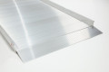 Close up of the end of wheelchair ramp kit on a white background