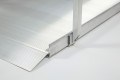 Handrail attached to wheelchair ramp on a white background