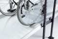 Wheelchair going up wheelchair ramps with joining support 