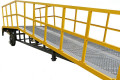 Mobile yard ramp with dual handrails