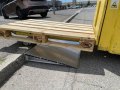 Pallet truck going up aluminium wedge ramp 