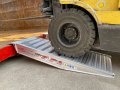 Pair of aluminium container ramps resting on container
