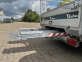 Aluminium loading ramps stored under trailer bed