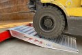 Forklift driving up ramps 