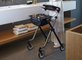 Space rollator with tray in use 