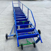 Mobile ladder laying flat on the ground