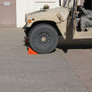 Wheel chock in front of tyre