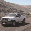 Wheel chocks around pick up truck wheel