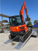 Digger driving up ramps 