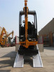 Digger driving up ramp