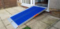 Premium wheelchair ramp resting on step