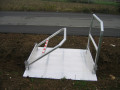 Partially collapsed handrails on vehicle gangway