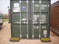 Rubber kerb ramps next to container 