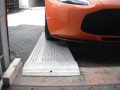 Sports car on car loading ramps