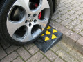 Vehicle on rubber kerb ramp 