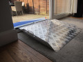 Threshold ramp on threshold with wheelchair ramp