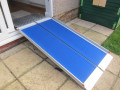 Wheelchair ramp up and over kit in use