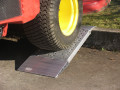Vehicle driving up container ramps 