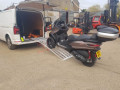Moped going up motorbike ramps 