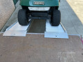 Buggy driving up alloy ramps 
