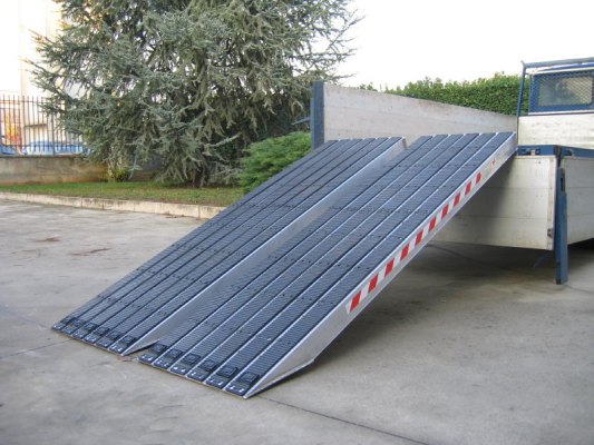Rubber tracked loading ramps on tipper truck 