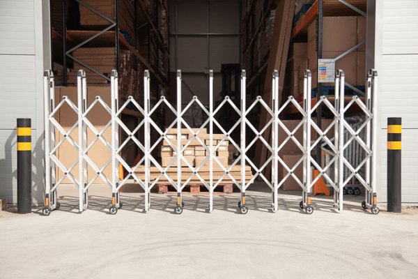 Aluminium expandable barrier outside warehouse 